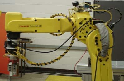 (a) (b) Figure 1: (a) Fanuc M6i Robot Workcell and (b) 3D Stereo Process in Fanuc VisLOC vision and