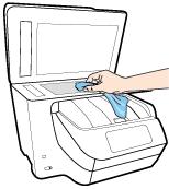 2. Clean the scanner glass and lid backing by using a soft, lint-free cloth that has been sprayed with a mild glass cleaner. CAUTION: Use only glass cleaner to clean the scanner glass.
