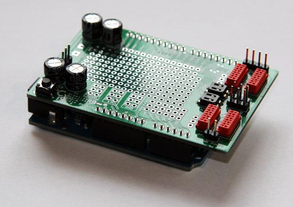 insert the long ends of the headers into an Arduino before placing the board on