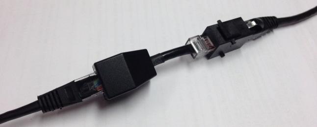 1. Using a patch lead from the gateway and an RJ45 Jack to Jack through connector on its non-gateway end, plug the adapter RJ45 Plug into the through