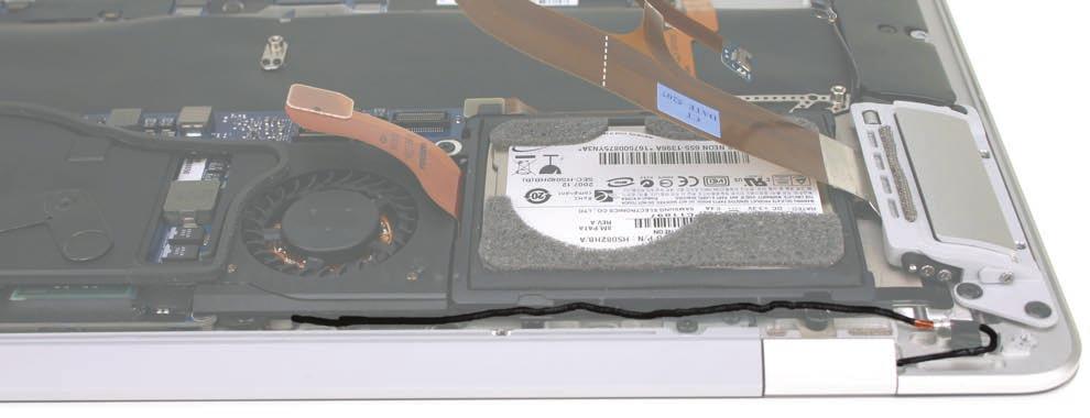 7. On the reverse side of the hard drive assembly, examine the routing to the microphone cable