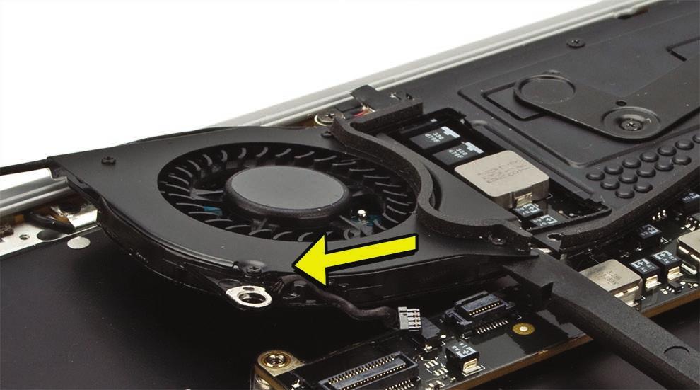 4. Lift just enough for the fan to clear the screw boss as you slide it out from under the thermal module arm. Use the same method when replacing the fan.