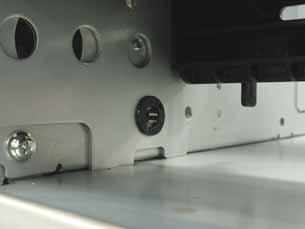 Place the two Spacers (short) under the RFID Module, and secure them to the RFID Plate with the two SMW-2x10 Screws.