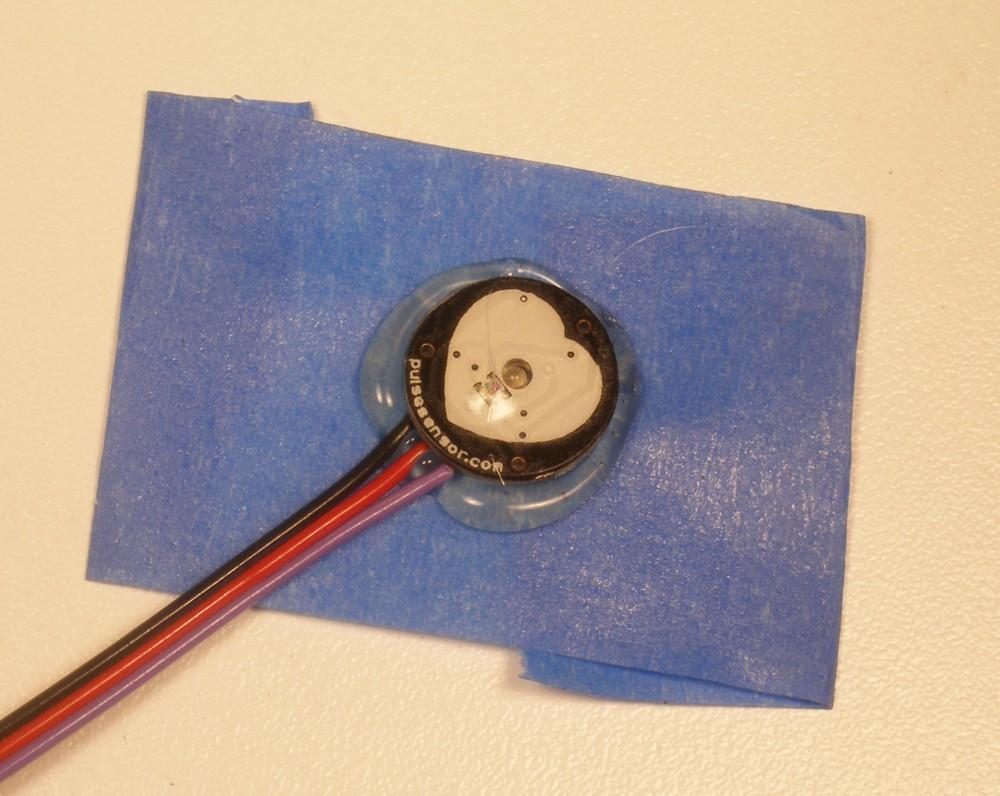 This How-To uses hot glue, which can be removed easily or re-worked if you want to change where you ve stuck your Pulse Sensor. We love hot glue!