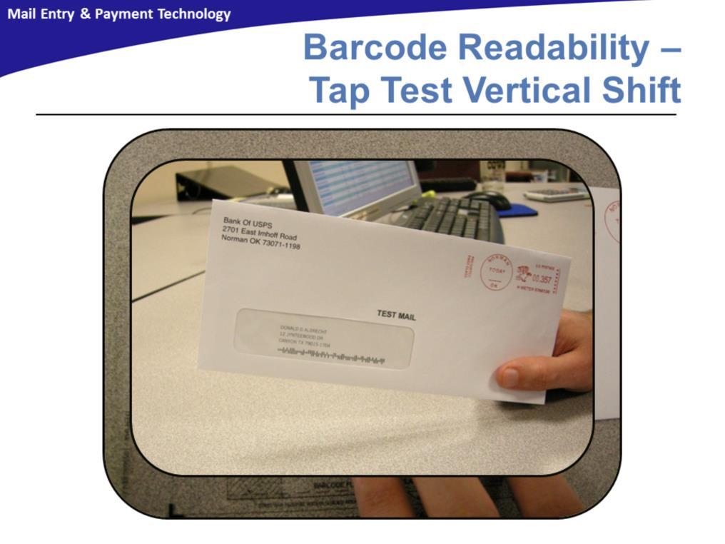 To perform the tap test, randomly select 10 window envelopes from the mailing. First check for Vertical Shift. Tap each individual mailpiece twice on a flat horizontal surface on its bottom edge.