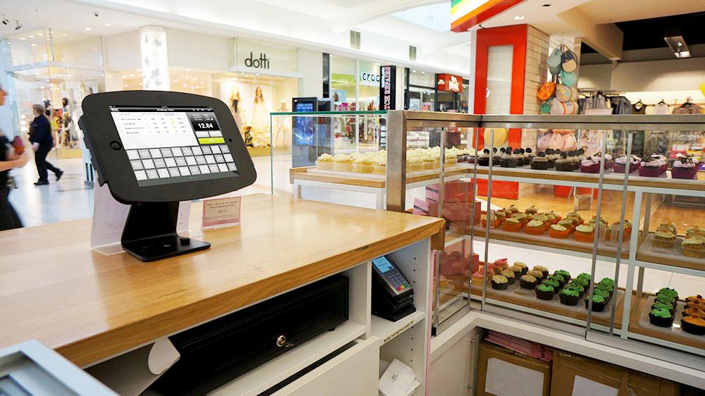 POS SOLUTIONS Top of the line secured point of sale kiosks, enclosures and stands that
