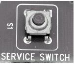 On a full console machine or on a stack dryer the service switch is located on the control board near the P11 Aux