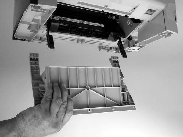 Fully open the print-cartridge door and gently pull downward on both print-cartridge swing arms (callout 1) to release them.