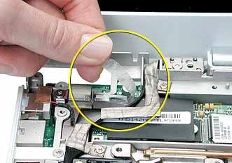 Procedure 1. With the computer on a soft cloth, remove the two Phillips screws from the modem board. 2.