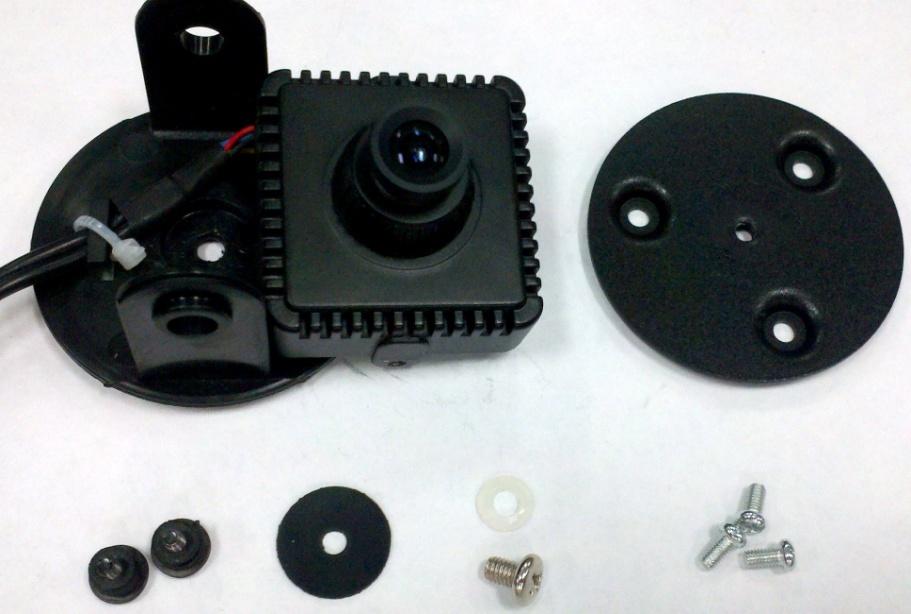 Figure 2 shows the parts referenced in this section. 6. Use the camera s metal bracket as a template to mark the hole pattern in the mounting surface. 7.