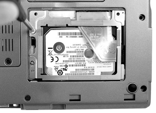 5. Press the left side of the bracket into place, and install the two silver screws. WARNING: You must use the same two silver screws (M2.5 x 4L) that you removed when removing the hard drive.