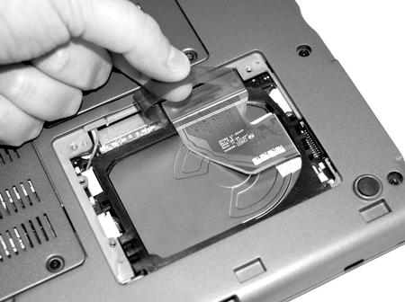 5. Carefully remove the hard drive connector from the motherboard by slowly and evenly pulling the plastic lift strap straight up and with equal force on each side of the lift strap.