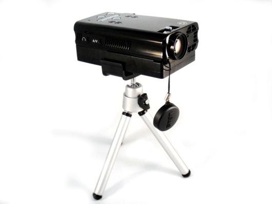 Mount Clip Projector on mount clip and tripod with battery First you must insert the battery into the projector (following instructions in this manual), then simply clip the mount clip onto the