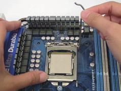 Then completely lift the CPU socket lever and the metal load plate will be lifted as well.