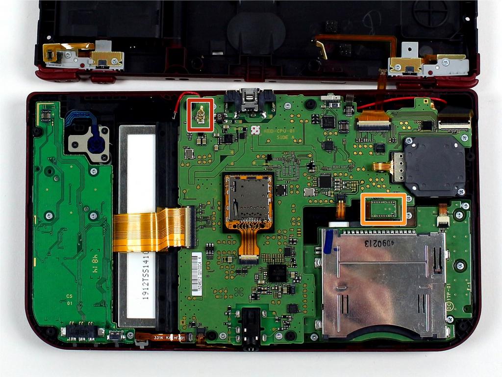 Locate the gold terminal plug with a red cable at the top left of the motherboard.