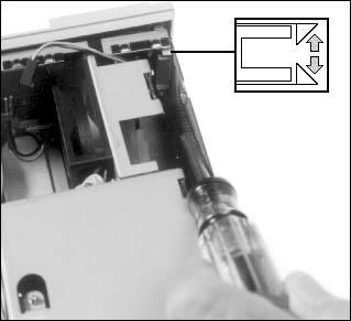 Power Supply 8. Use a screwdriver to release the clips holding the front bezel in place, then push the bezel forward about 0.5 inches. 9.