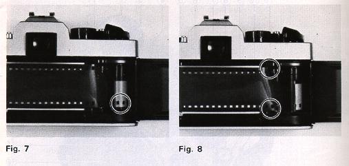 Rotate Film Take-up Spool (28) by advancing Film Advance Lever ( 11 ) to take up any slack in the film and check to see that the film tip is firmly hooked onto Film Take-up Spool (28)