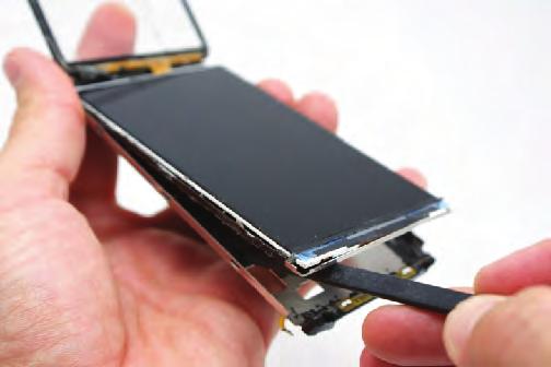 Do not completely remove the touch screen from the phone because there is still a ribbon cable routed under the LCD.
