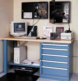 Workbenches with butcher block worksurfaces house an array of electronics equipment everything from diodes to large control units with drawers custom configured to create an organized home for