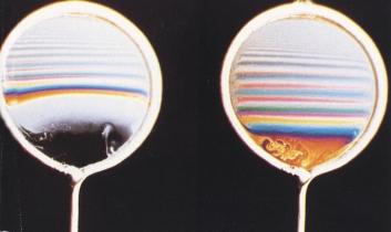 The effects of gravity on a vertical soap film cause the film to be wedge-shaped, thin at the top and thick at the bottom, with the thickness changing in a reasonably uniform way.