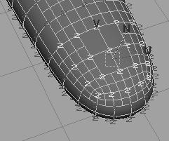 Lesson 1 > Creating a crease in a subdivision surface Selected vertices 8 Drag the Move Tool s N manipulator down slightly to form the depression of a fingernail