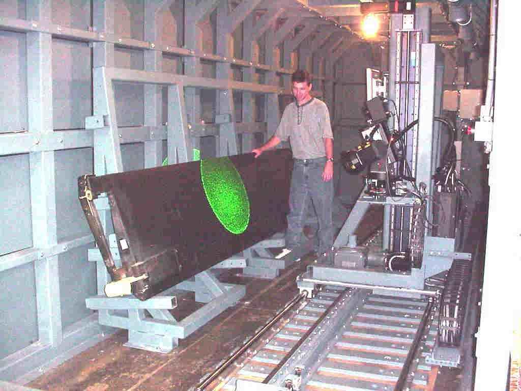 Fig. 3, X, Y Gantry Inspection System with Helicopter Blade Fixed Production Shearography Systems First introduced on the USAF B-2 production program, gantry mounted shearography systems share many