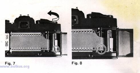 Rotate Film Take-up Spool (32) by advancing Film Advance Lever (11 ) to take up any slack in the film and check to see that the