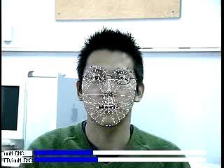 The face detector finds their face and initializes the tracker.