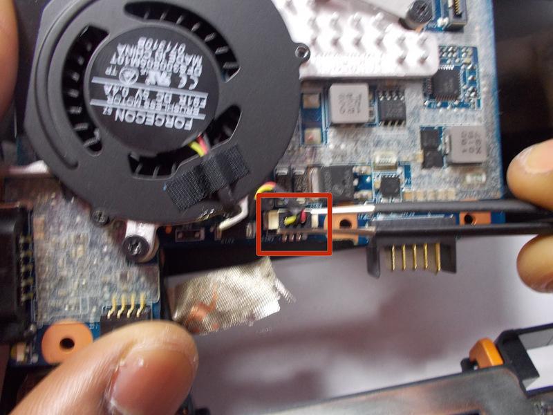 Carefully remove the cable that is attaches the fan to the motherboard.