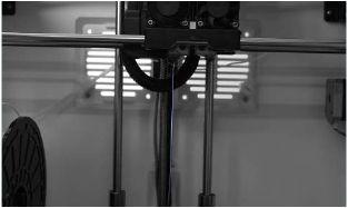Continue loading to ensure that the filament is extruding in a straight