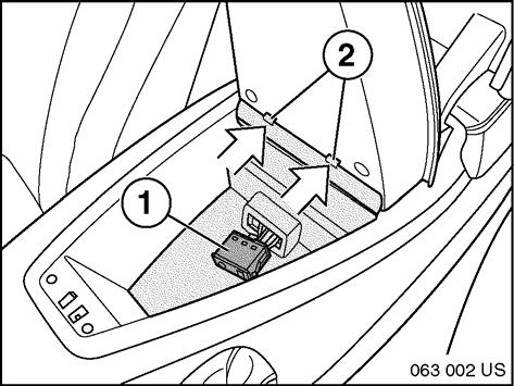 Plug cables into USB/AUX connector (1) and attach trim panel (2) to the bottom of the eject box in direction of arrows. 12.