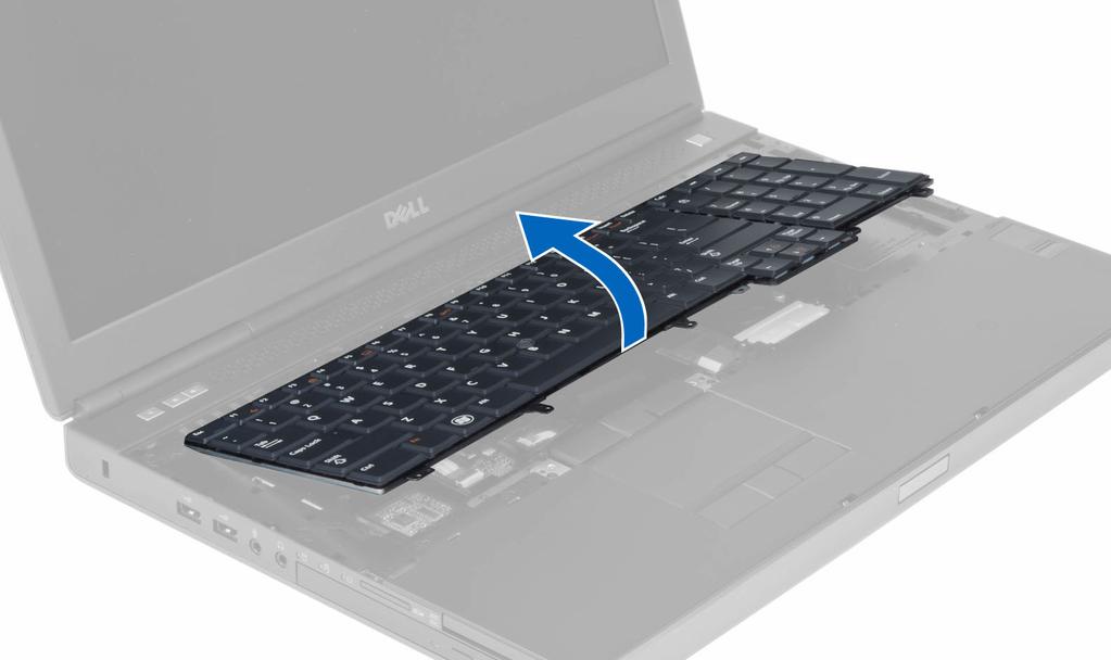 4. Starting from the bottom of the keyboard, separate the keyboard from the computer and flip the