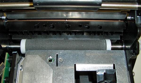 8.1.5 Platen (Rubber Driver Roller) The Platen (rubber drive roller) should be cleaned once a year to prevent paper dust from building up on the roller.
