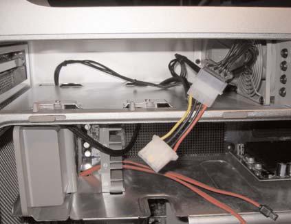 The black SATA Power Connectors plug into the drives while the white 4 Pin patch connector goes in-line with the DVD