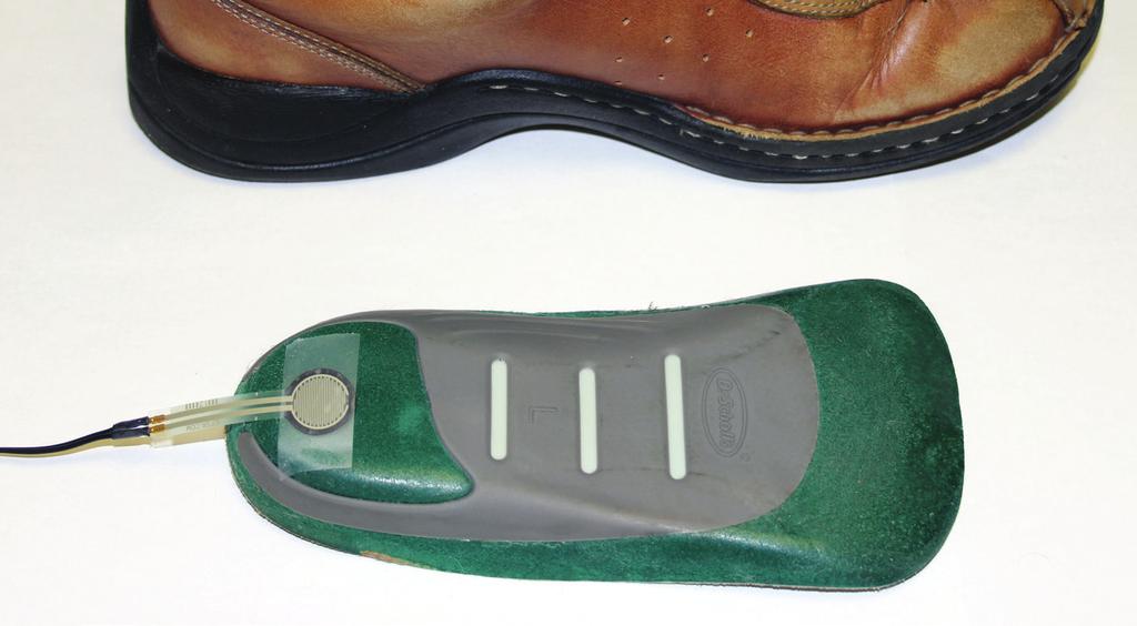 Placing the FSR membrane on the bottom of the inner shoe sole, provides some added protection to the device, as load and shear forces are diffused between the show base and the sole.