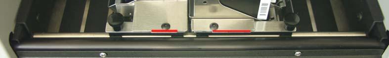 The red lines, at the exit end of the print unit, can be used to approximate the print