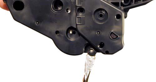 Figure 34 Figure 36 19) Take the Dremmel tool again and cut away the recessed plastic rivet