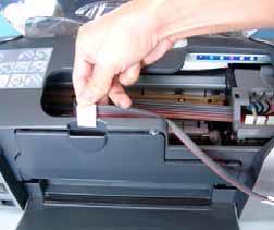 5) Tube set up R series printer a) Place the tube clip onto the front of the printer.