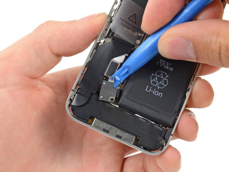 Use a plastic opening tool to gently detach the battery connector from the socket on the device.