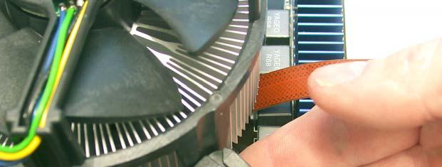Use one hand to provide support below the heatsink location plate while pushing