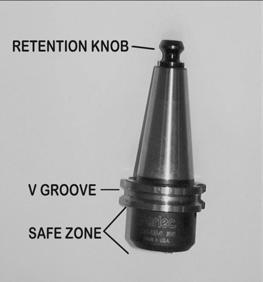 Section 7: Spindle Manual Operations Manually Loading and Unloading a Holder A tool can be manually loaded or unloaded into the spindle by using the TOOL IN/OUT button.
