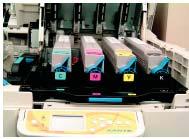 to side to distribute toner. Remove locks and seals from the toner cartridge. Remove sealing tape from toner cartridge. 14. Lock toner cartridge with colored lever.