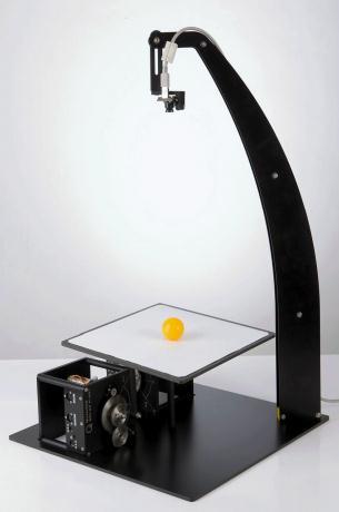 The overhead camera tracks the position of the orange ball on a white background.