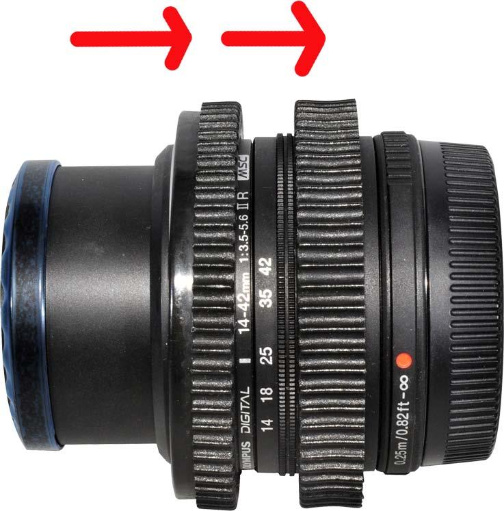 Use Zoom Control Button (20) on the housing to manually adjust the zoom. Use Focus Control Button (18) on the housing to adjust the focus for this lens. Olympus M. ZUIKO 14-42 f/3.