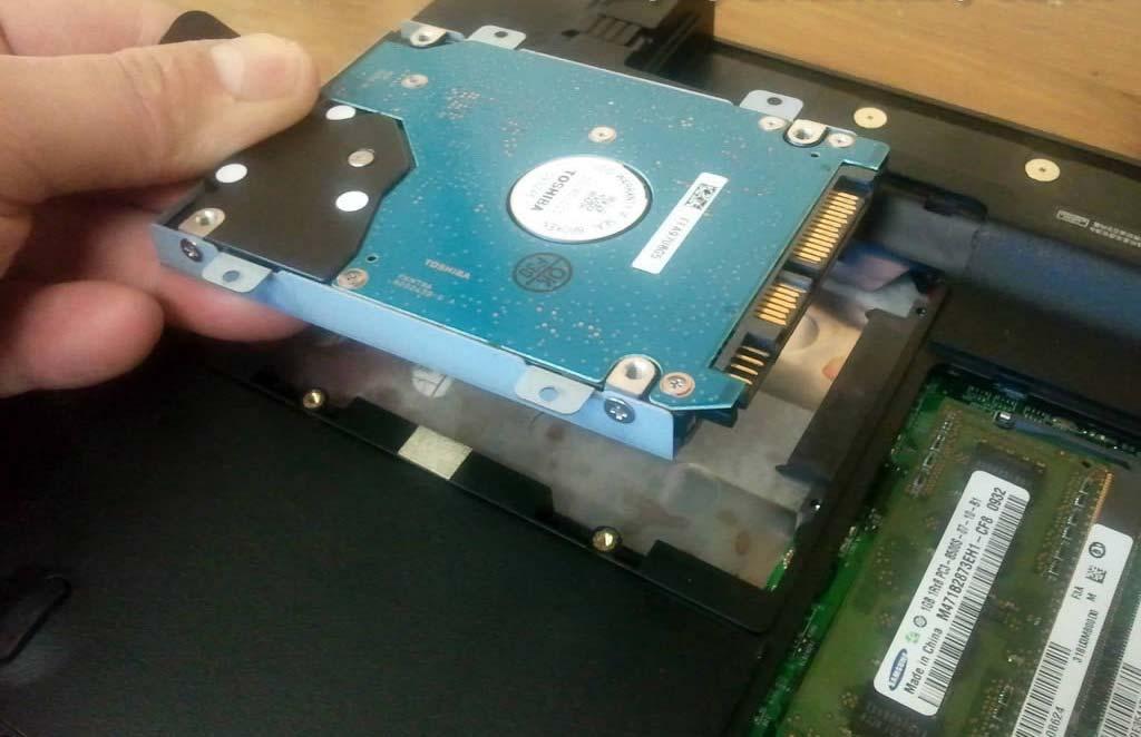 STEP 4 Lift up and remove the hard drive assembly.