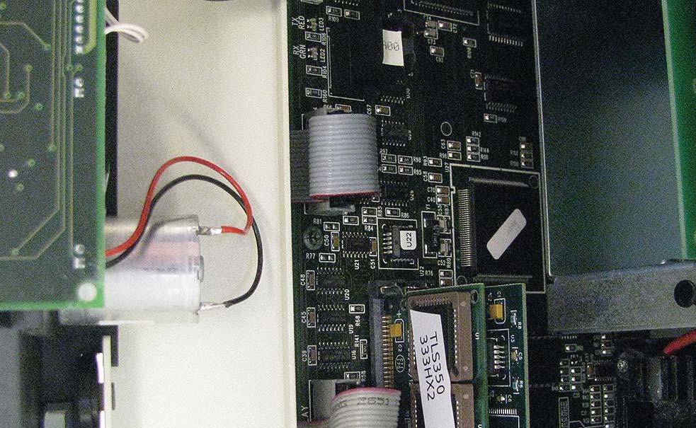 Disconnect the Display ( upper) and Keyboard ( lower) cable connectors from the consoles CPU board as