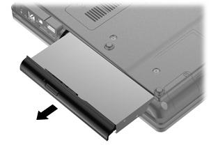 8. Using a flat-bladed screwdriver, gently push the tab to release the optical drive (2).
