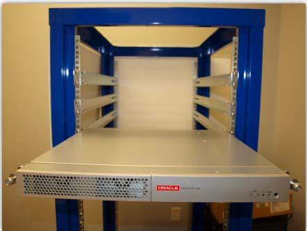 8. Pull the Acme Packet 3900 to the front of the rack until the chassis assembly stops. Figure 5-91. Extended chassis system 9. Push the chassis cover backwards about 1/2 inch. 10.