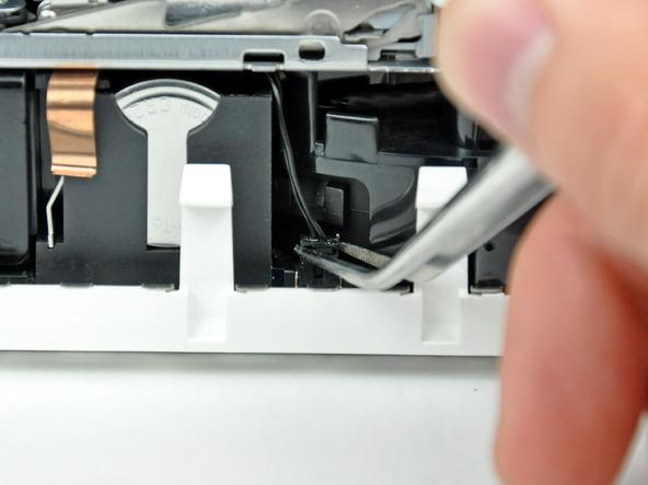 Step 9 Rotate the mini so that the SuperDrive slot loading mechanism is facing you.