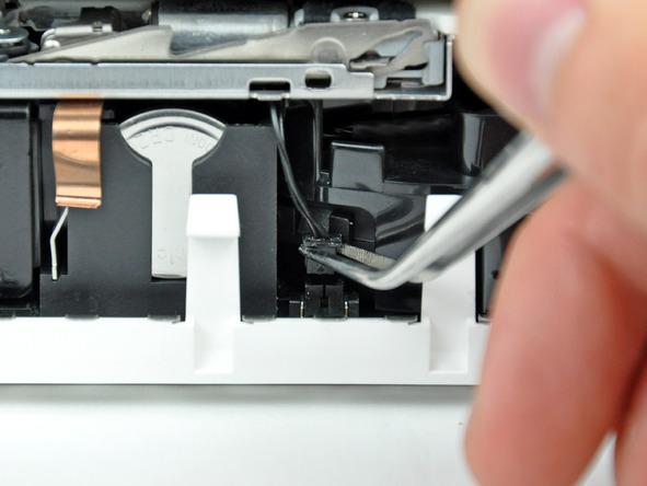 logic board. Use tweezers to grab the connector (as seen in the picture), not the wires.